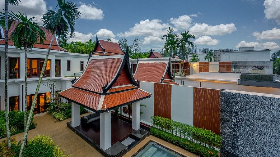 image of the view from the first floor of the villa with a blue sky with patches of clouds - three bedroom private pool villa