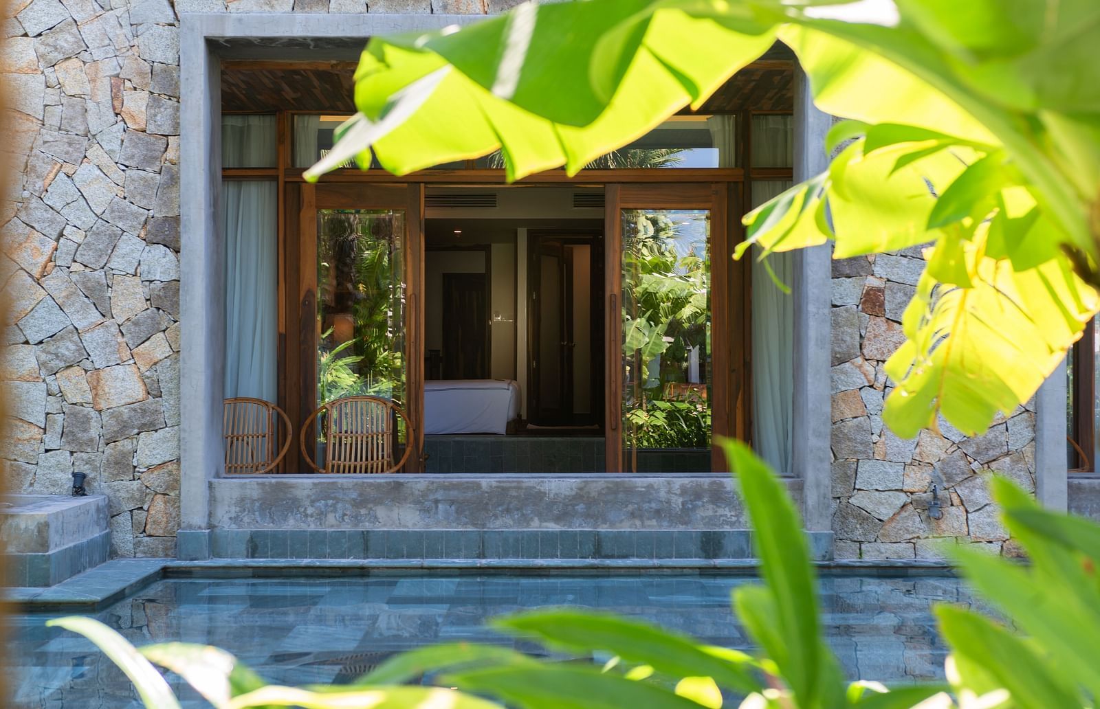 A view of the hotel room with a sliding door - Alibu Resort Nha Trang
