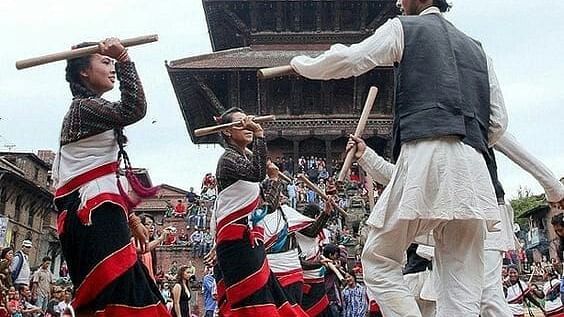 Men and women celebrating the Gai jatra festival