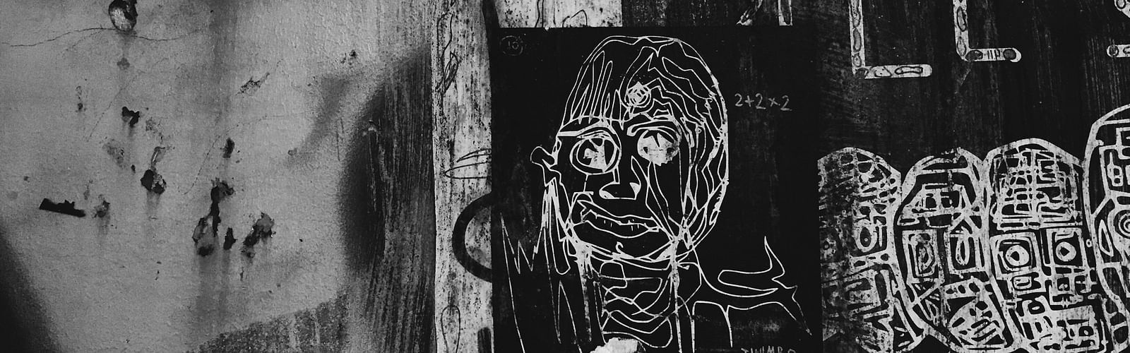 An overview of a black and white image with a Graffiti on a wall on Sukhumvit road.
