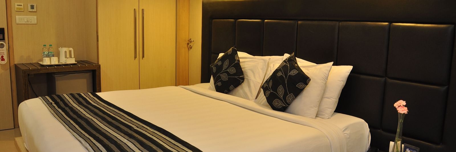 Image of Premuim king room with large bed abd moden amenities at The Oriental Residency