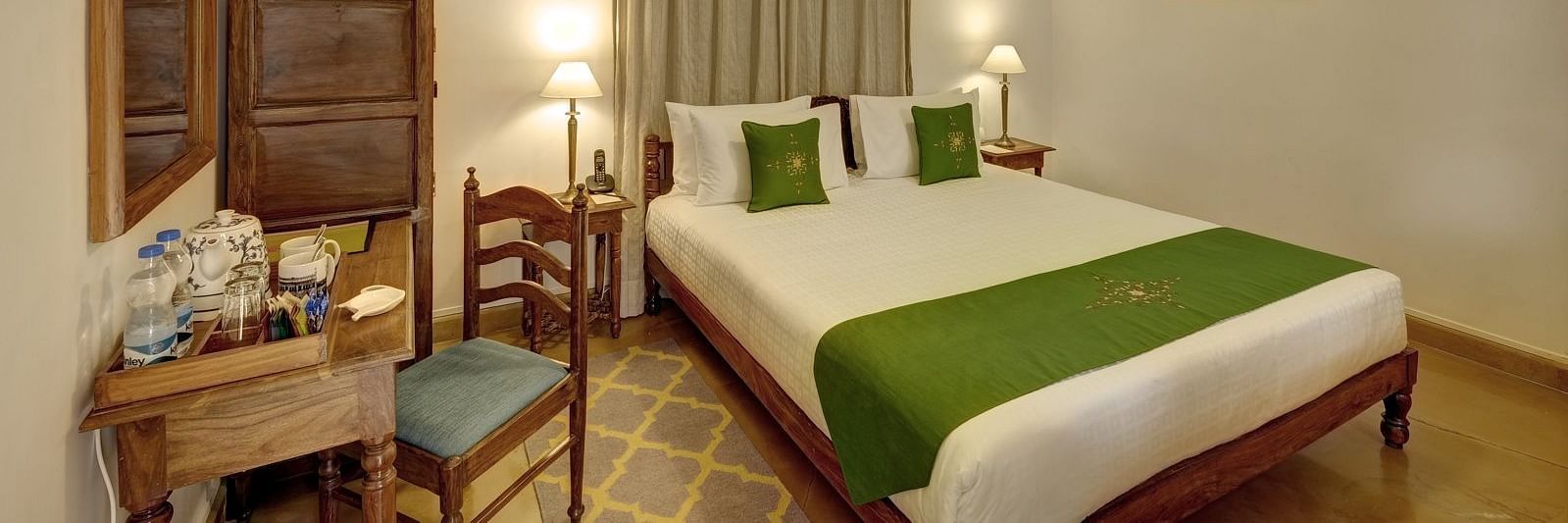 Residency Room with a double bed and work desk and chair at Saraca Hotel, Lucknow
