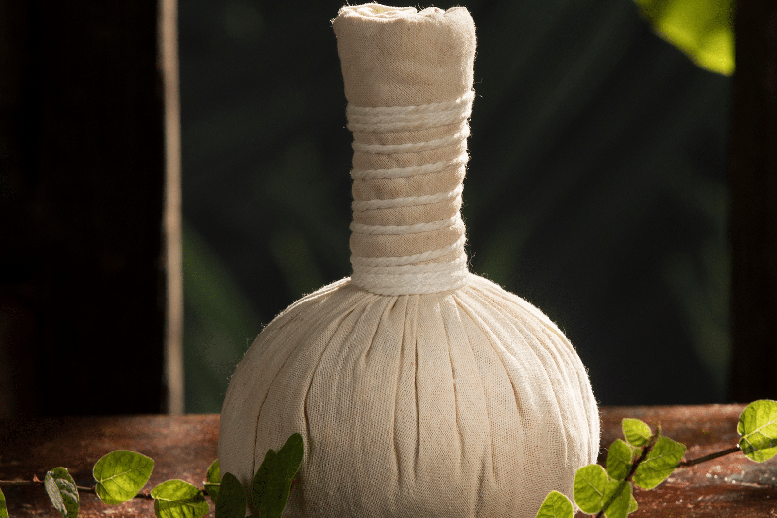 a close up shot of a potli kept on a table - Rhythm Kumarakom