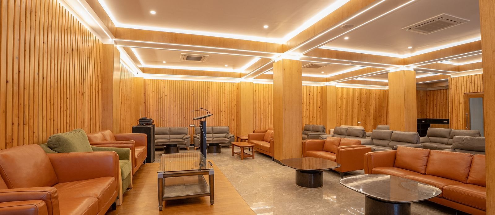 event hall with brown sofas at Summit Grand Resort & Spa