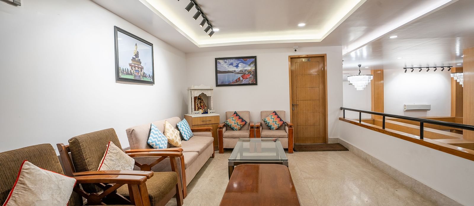 Reception area with brown chairs and brown table at Summit Grand Resort & Spa.