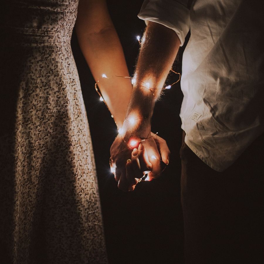 Couple's hands wrapped in fairytale