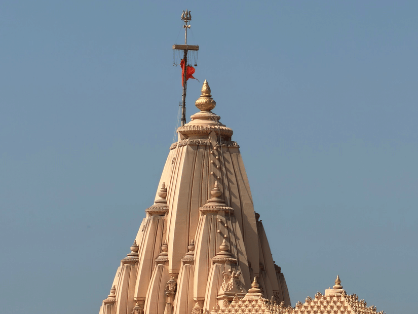 An aerial view of a temple tomb with a red flag on top.