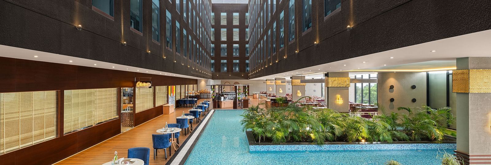 Blue Salt Cafe at Essentia Luxury Hotel, Indore with poolside seating arrangement