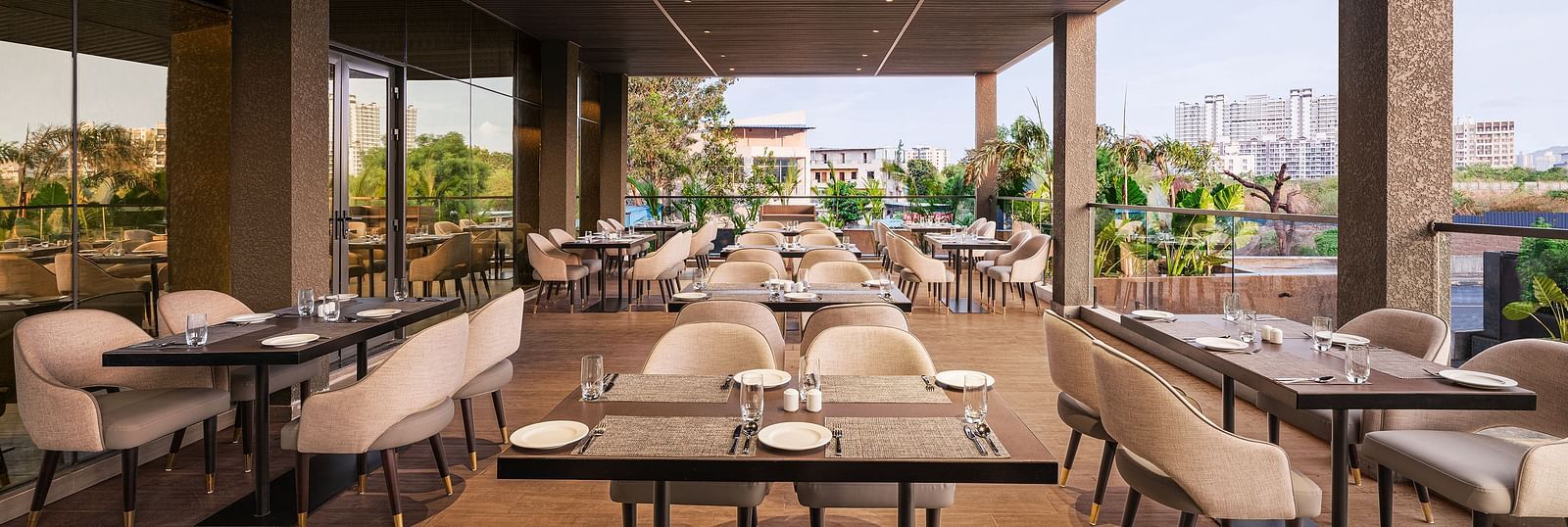 A view of dining area at Citron Bar with comfortable seating at Essentia Premiere, Pune.