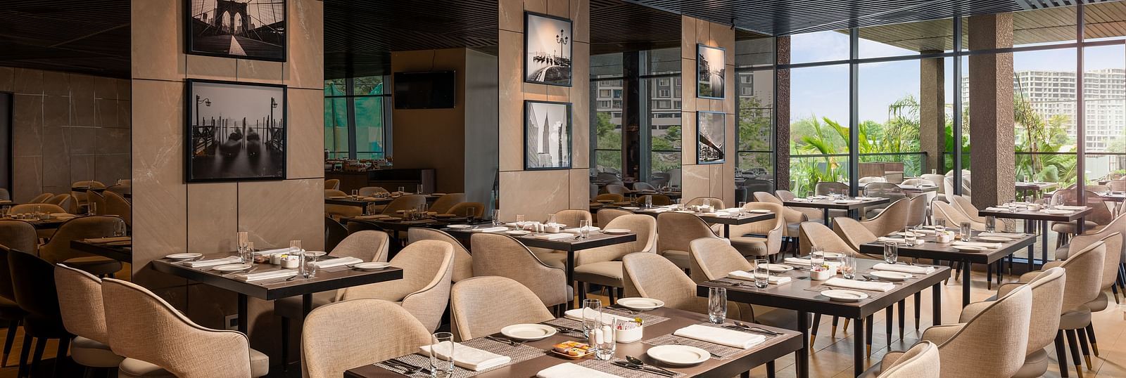 A view of dining area at Citron Bar with comfortable seating at Essentia Premiere, Pune.