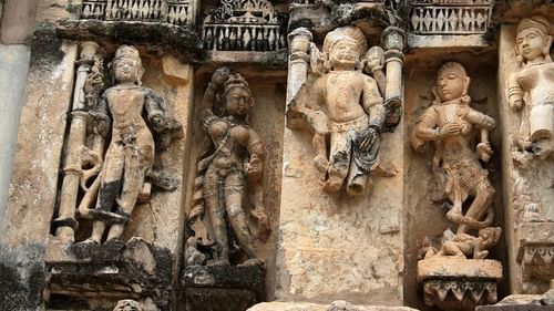 Image of human-like stone figures that are sculpted on stone