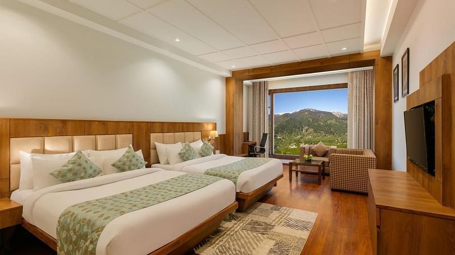 room with commodious twin king size beds overlooking the mountains and greenery