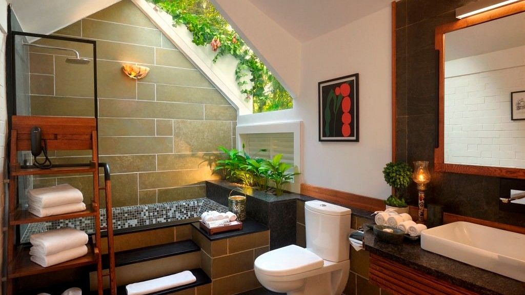 bathroom with a bathtub and plants kept on the side