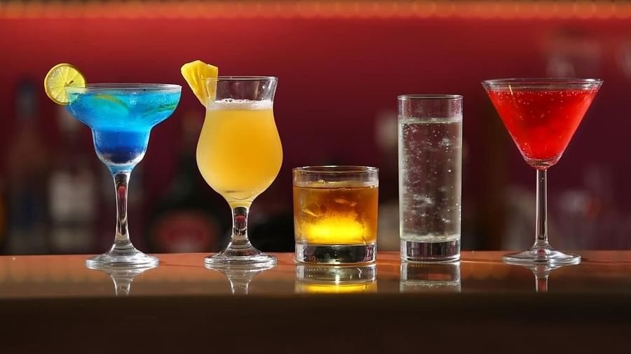 A variety of drinks in different sizes arranged on the table.