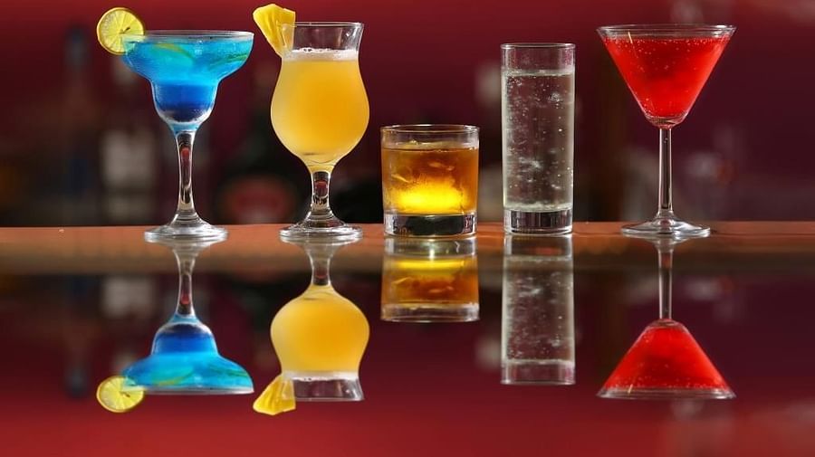 A variety of drinks in different sizes arranged on the table
