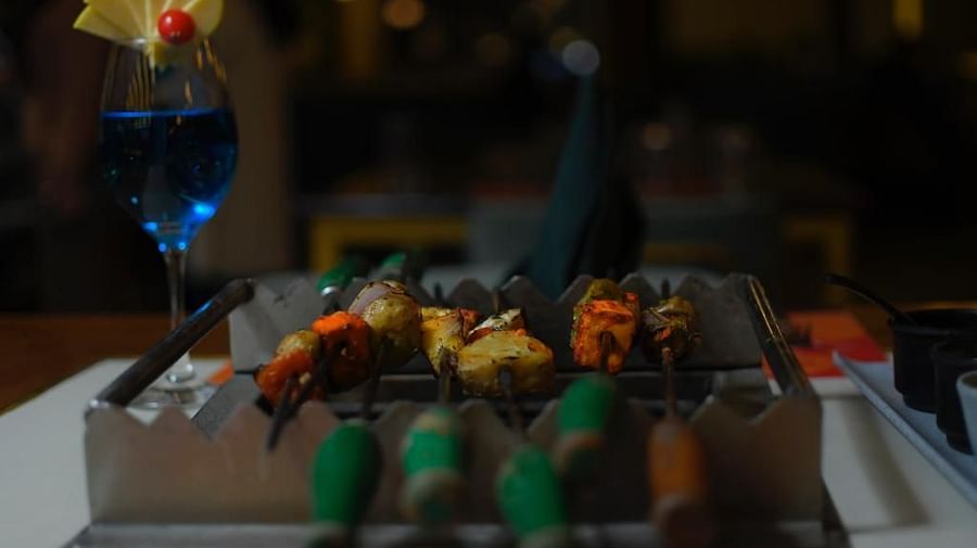 An image of a barbecue grill at Themis Barbecue House, NSP Pitampura