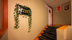 Entance to MEZZE9 Bar Kitchen with the signage of Mezze9 on the wall - VITS Sharanam, Thane