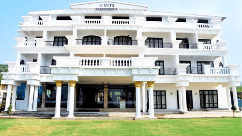 facade view during the day with a manicured garden in front of the hotel - VITS ExcellenSea, Dapoli