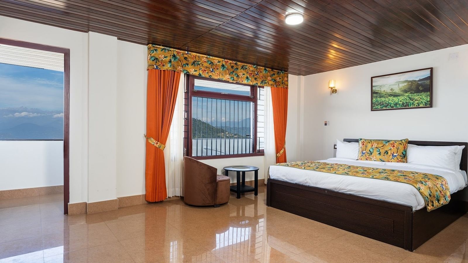 Image of a room with bed and wooden ceiling and attached balcony at Summit Sherpa Mountain Hotel & Spa, Kalimpong