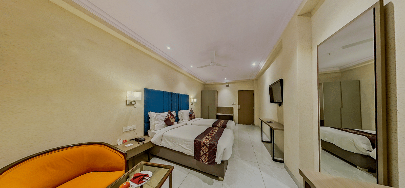 Premium twin bed accommodation at Lords Eco Inn Dahej featuring matching beds, stylish furnishing, and comprehensive guest amenities