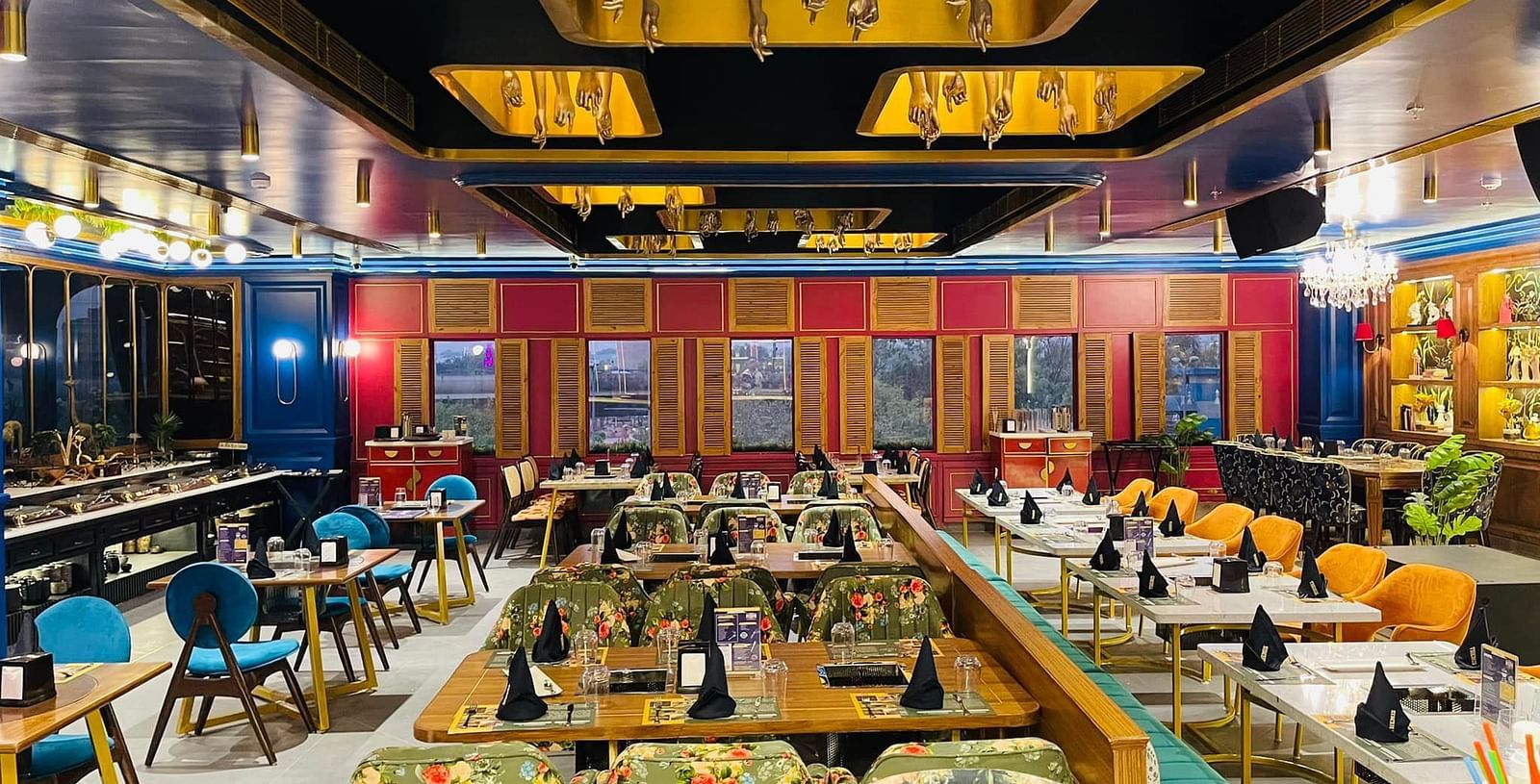 An image of a Restaurant Themis Barbecue House NSP Pitampura with various kinds of seating arrangements 
