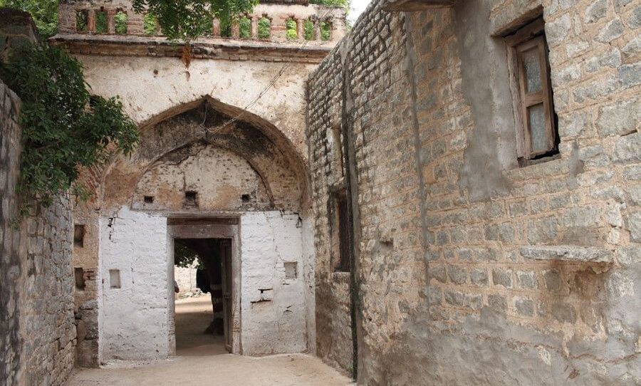 Arched doorway in an old stone building.