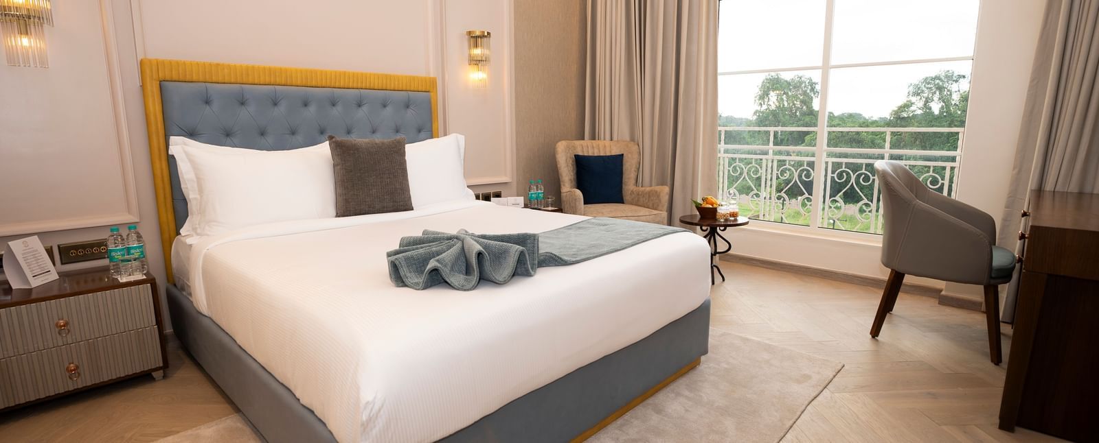 Stylish room with king bed and scenic view at Miros Hotels.