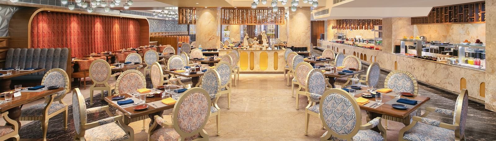 A spacious dining hall featuring modern decor and warm lighting - Kaldan Samudhra Palace