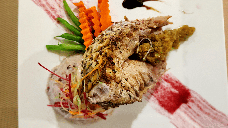 A lobster dish served with a side of sauce - Hotel 39, Jamaica