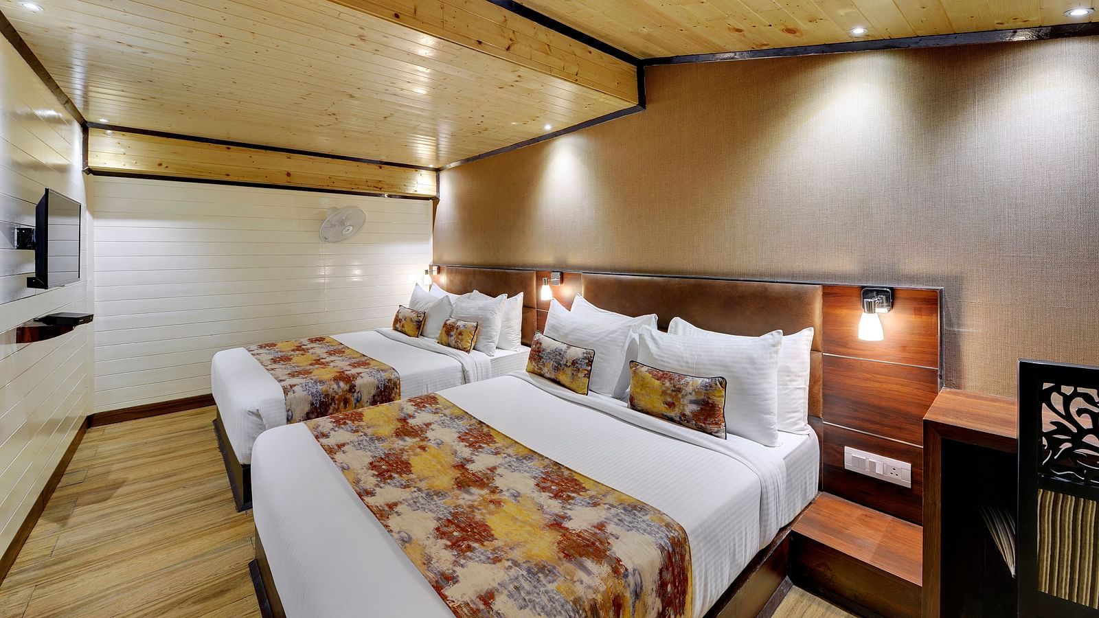 Image of Deluxe Family Room with two beds and a television in front at Yashshree Mall Road, Darjeeling.