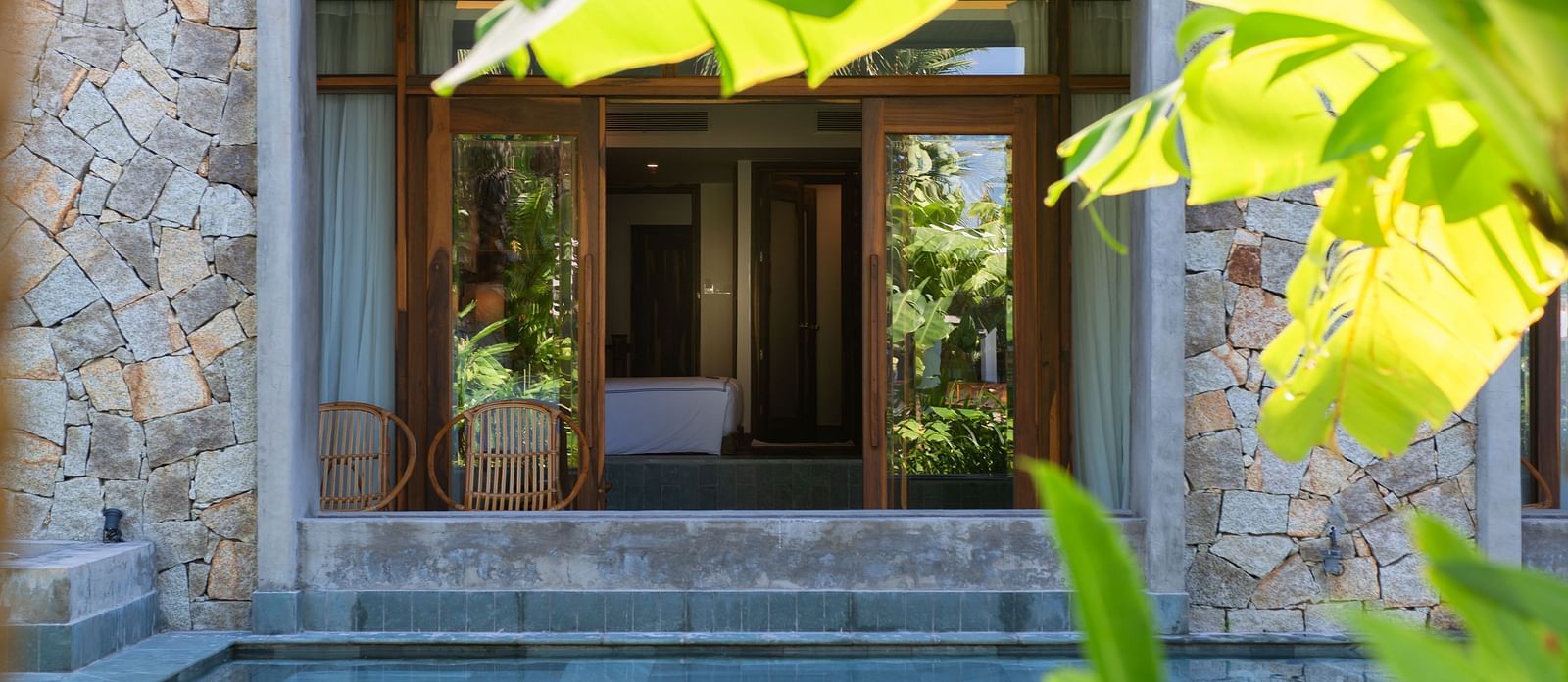 A view of the hotel room with a sliding door - Alibu Resort Nha Trang