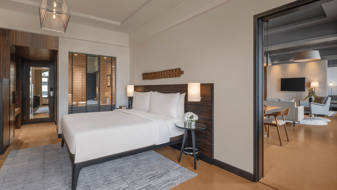 Bedroom with a double bed and attached sitting area at The Raintree, St. Mary’s Road.