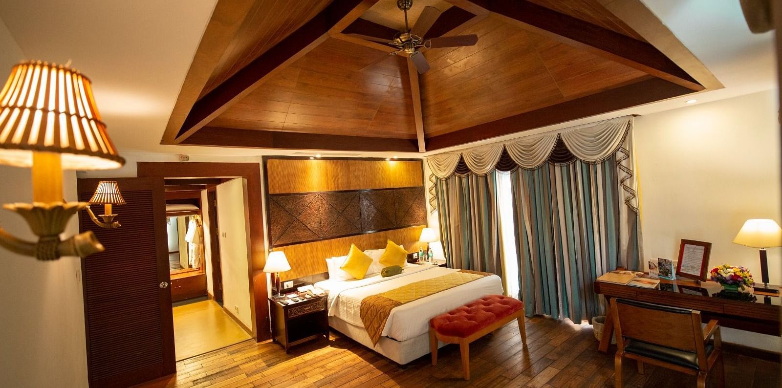 A beautiful interior with table lamp beside the bed at Ocean Spray, Puducherry