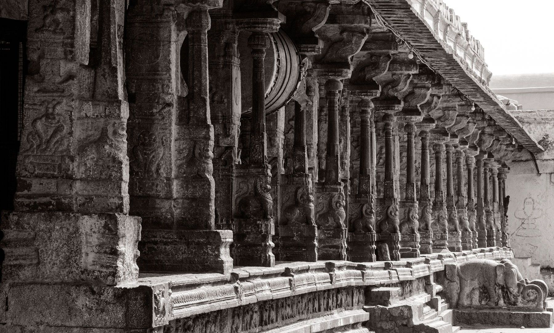 Ancient Hampi temple hallway in black & white.