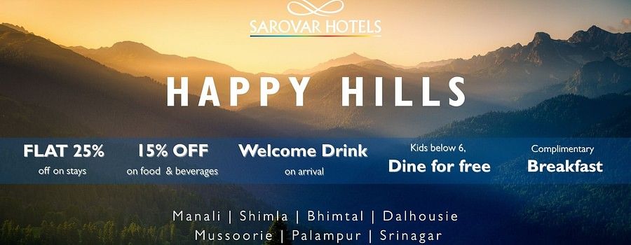 Happy Hills banner for Sarovar Hotels & Resorts showcasing offer discounts with a sunset-lit mountain landscape in the background
