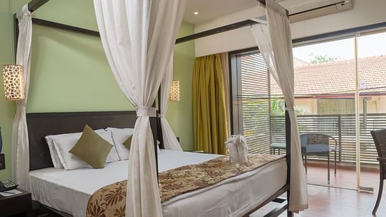 View of a king size bed in the Superior room at Kyriad Prestige Calangute, Goa