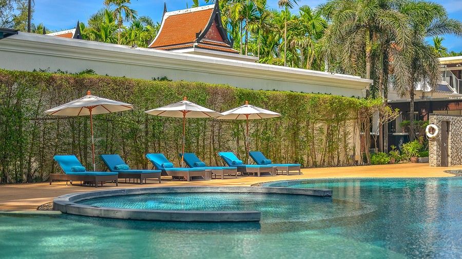 image featuring a line up of sun loungers on the poolside - Maikhao Dream Villa Resort & Spa, Phuket