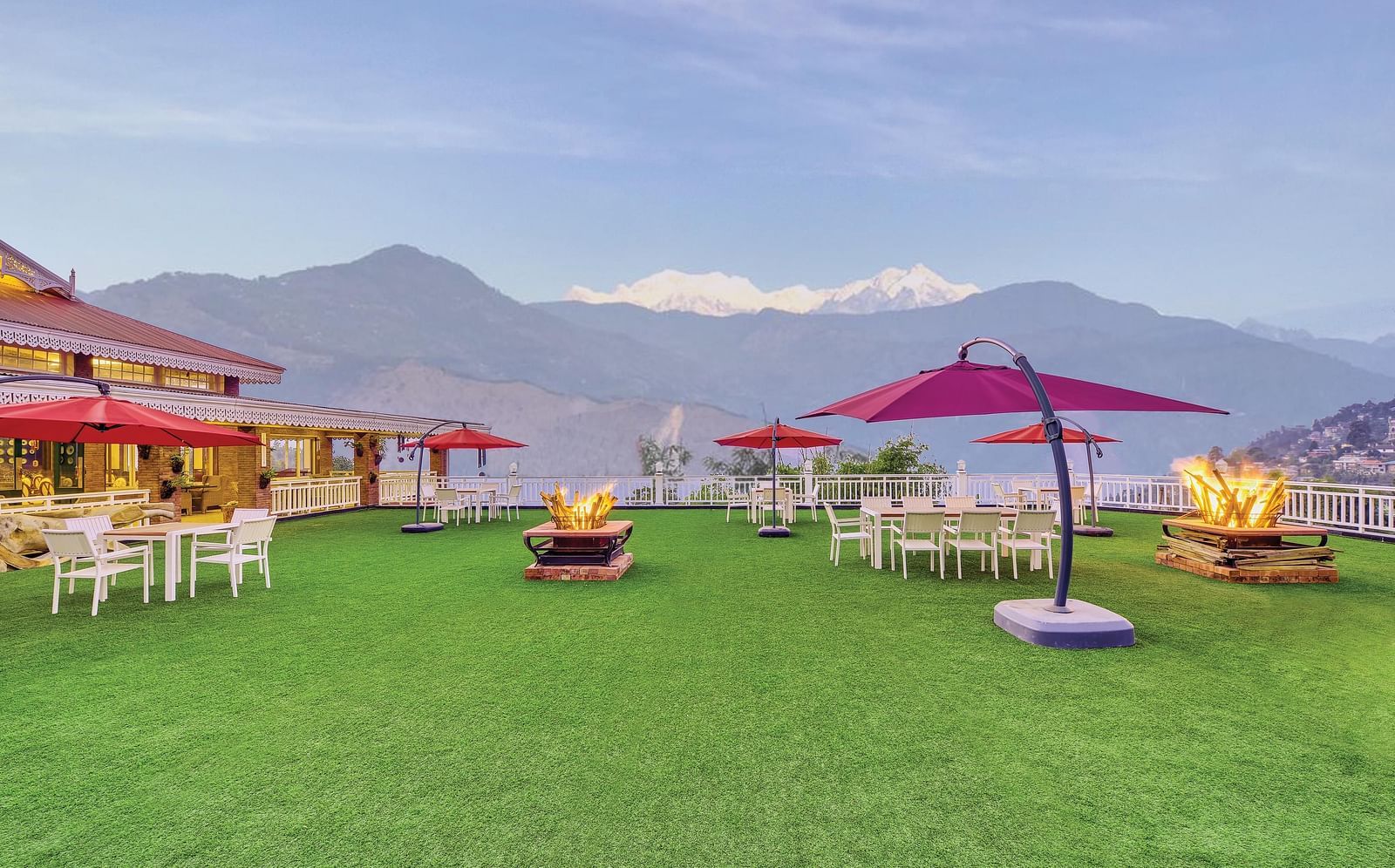seating spaces at the lawn overlooking the snow-capped mountains in the background - Mayfair Himalayan Spa Resort Kalimpong