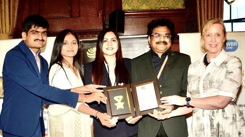 Image of the owners of the  resort receiving an award.