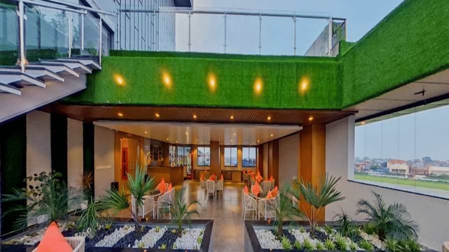 The lounge area of Distil Bar featuring chairs arranged on a wooden floor | Lords CBC Plaza, Chitwan