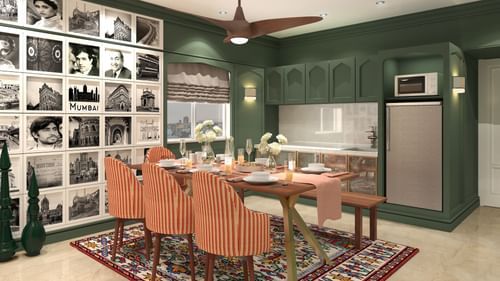 living room with dining chairs at theory9 bandra