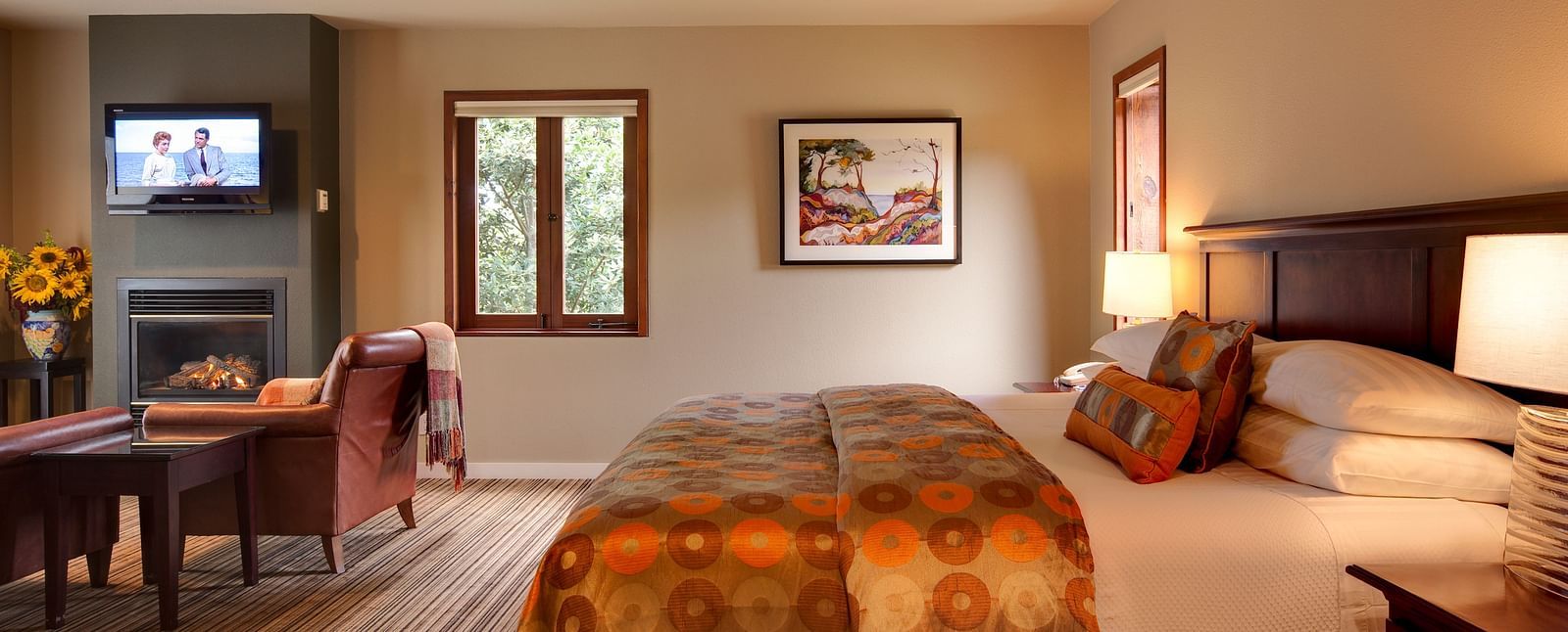A spacious room in Mendocino with a big bed and scenic view from the window- Brewery Gulch Inn & Spa