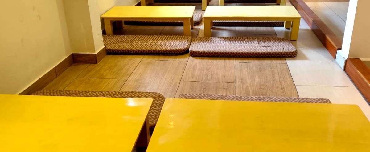 An expansive seating area on the floor featuring traditional Japanese dining at Ajito restaurant at Ilara Hotels & Spa, Tada.