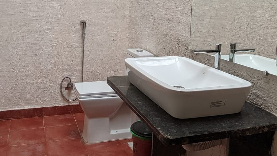 A washroom with a sink and a toilet at The Conservancy Bungalow.