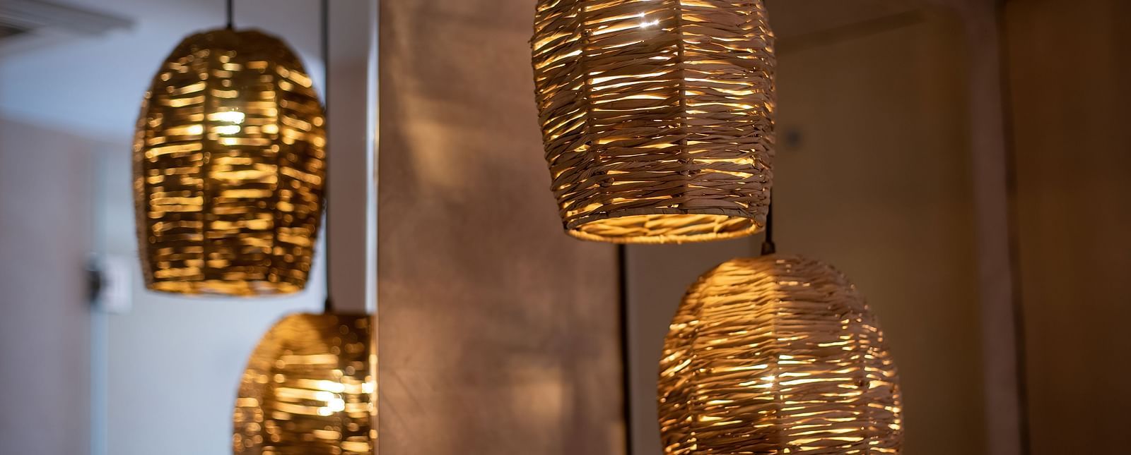 Bamboo lamps hanging from the ceiling at the Nepali Suite - The Nanee