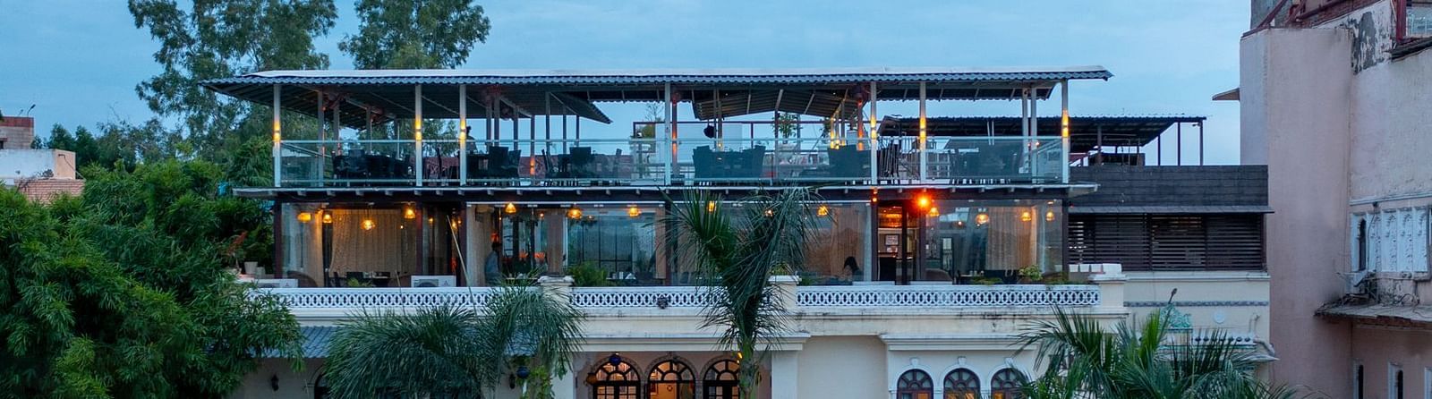 Facade view of the hotel during the evening with clear sky in background | Panna Vilas Udaipur