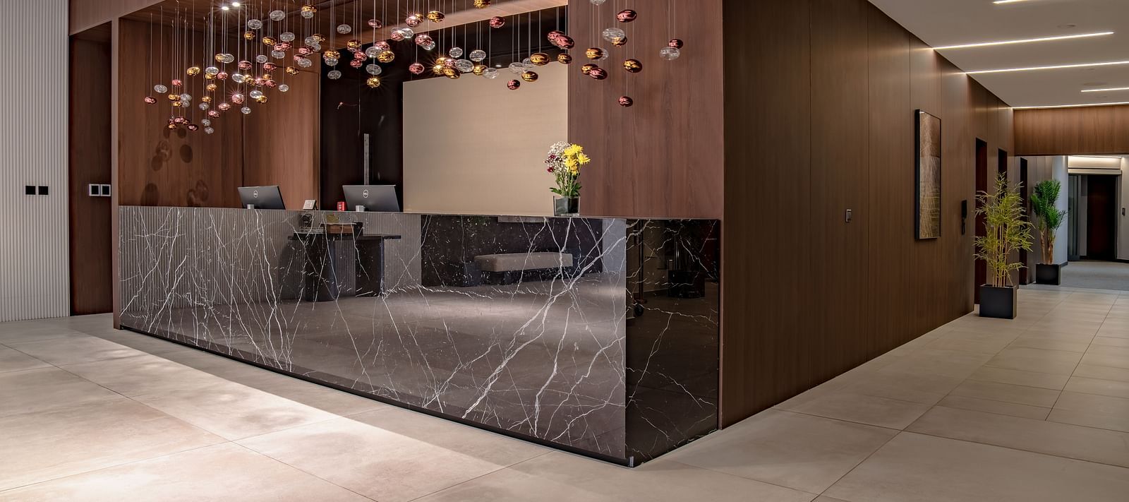 Elegant hotel lobby with marble floors, warm lighting, and modern decor. - The Pelican Hotel, Accra