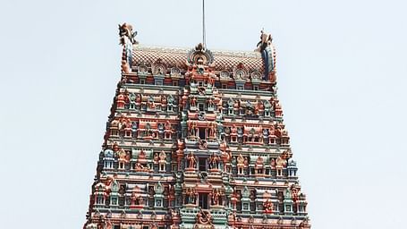 An exterior view of the temple showcasing intricate sculptures and architectural details, highlighting its cultural significance.