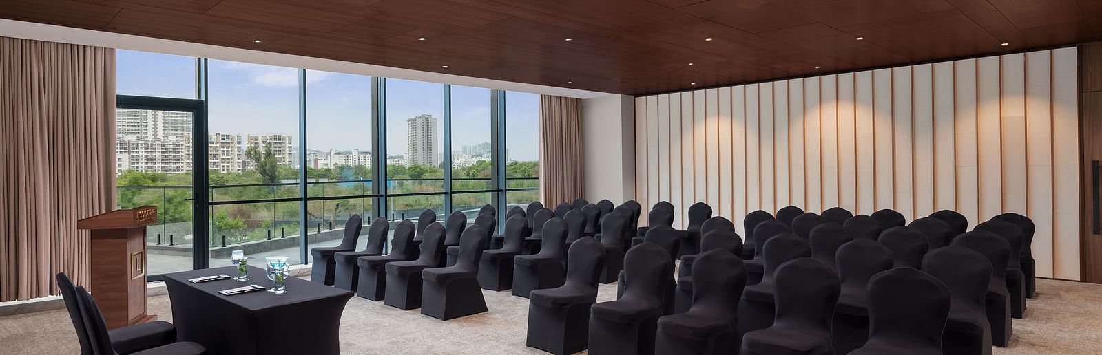 Carnival 1 with comfortable seating facing the stage at Essentia Premiere, Pune.