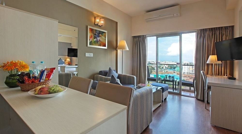 Living room area of the Deluxe Room at Starlit Suites, Bangalore